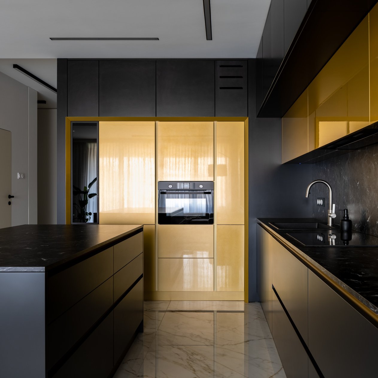 Elegant black and gold kitchen with kitchen island